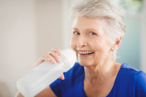 Senior Woman Drinking Water - Los Angeles Home Caregiver Service